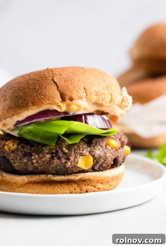 10 Effortless Summer Salads and Sides for Every BBQ 3 Flavorful Cilantro Lime Black Bean Burger on a bun, perfect for summer grilling.