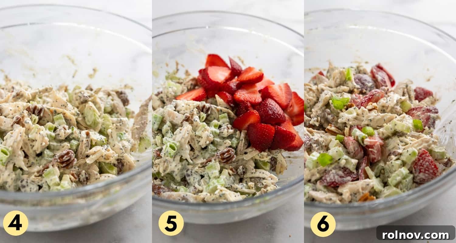 Berry Bliss Chicken Salad with Poppy Seed Pecans 6 Diced fresh strawberries are gently folded into the creamy chicken salad mixture in a mixing bowl, adding a burst of color and sweetness.