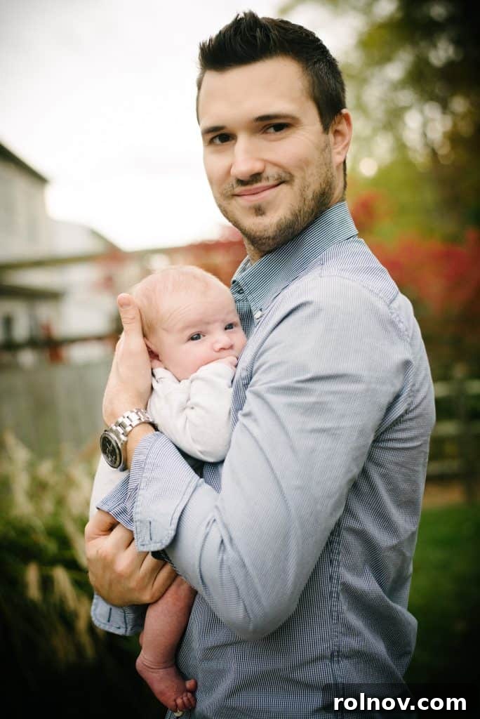 Our Adoption Story Continues 6 Anthony, our loving father, holding our newborn son, Samuel Noah, a symbol of our adoption journey and new family.