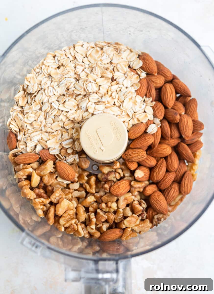 Almonds, walnuts and rolled oats in food processor.