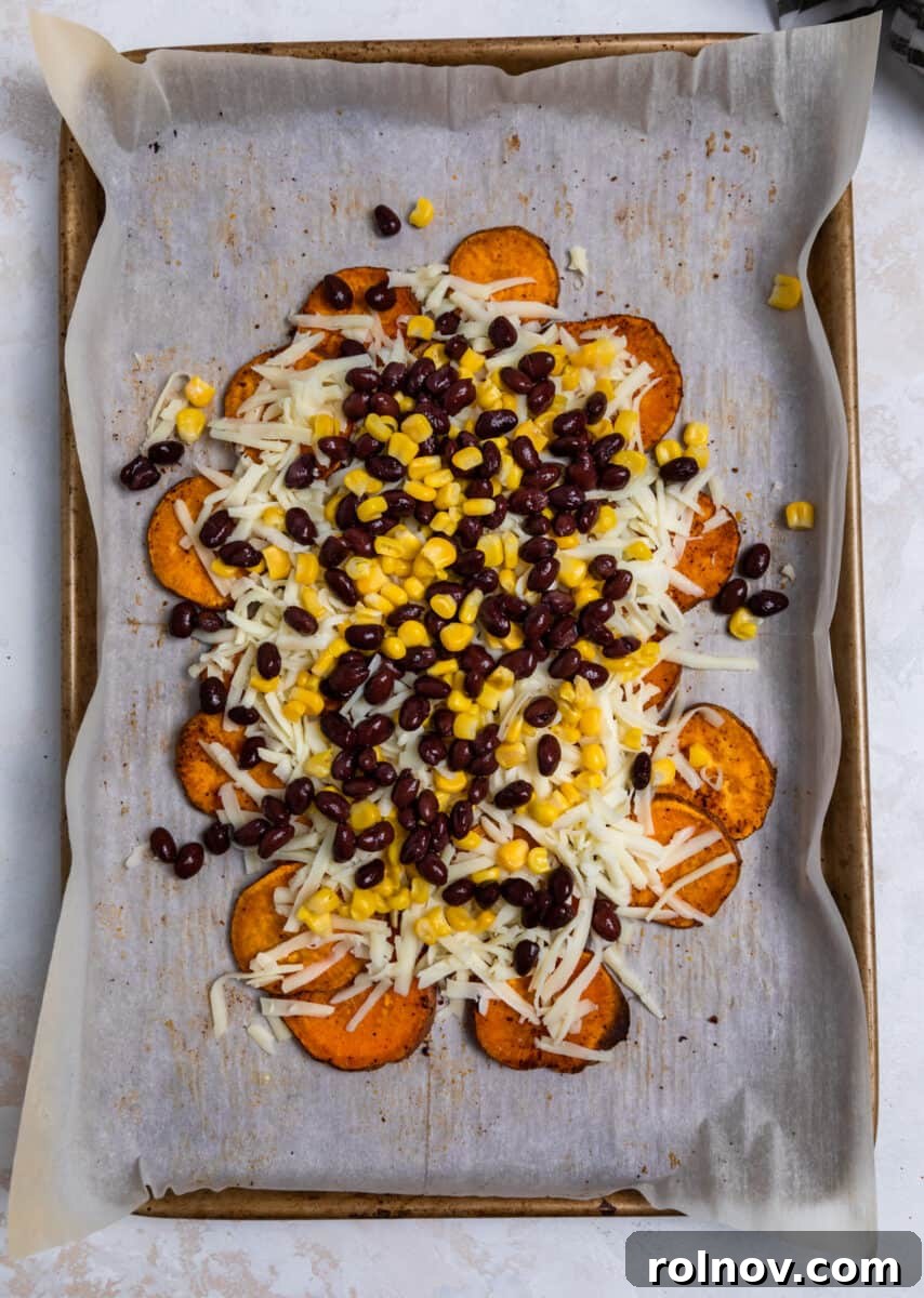 Shredded cheese, corn, and black beans generously layered over roasted sweet potatoes.