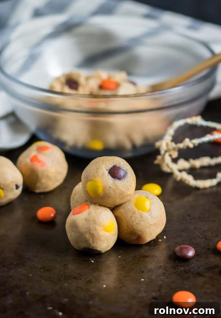 Peanut Butter Cookie Dough Nuggets 4 A bowl of freshly made edible peanut butter cookie dough with Reese's Pieces, ready to be rolled.
