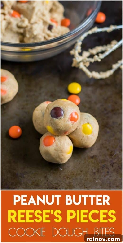 Peanut Butter Cookie Dough Nuggets 7 Stacked edible peanut butter cookie dough bites with Reese's Pieces, showcasing their delightful texture.