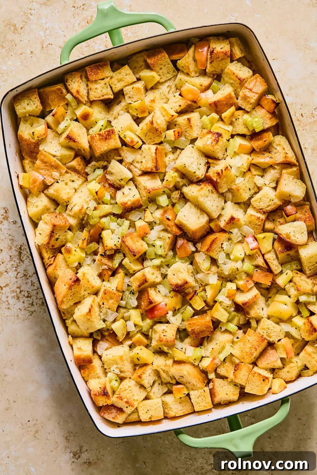 Homestyle Apple Sage Stuffing 12 Freshly baked apple stuffing, golden brown and garnished with fresh herbs, just out of the oven.