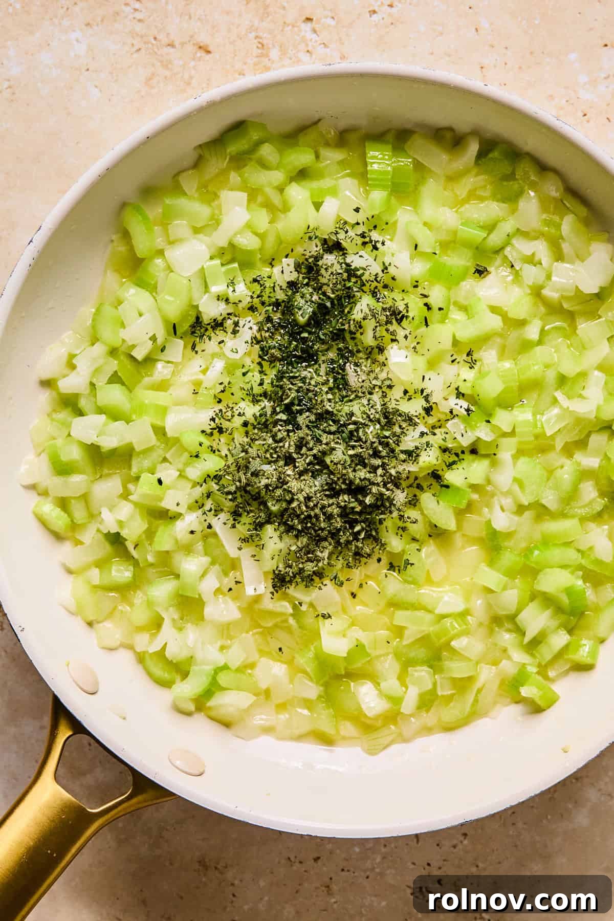 Homestyle Apple Sage Stuffing 6 Sautéing butter, celery, onion, and fresh herbs in a large skillet until softened.