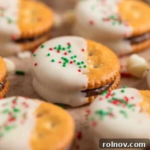 Nutella stuffed Ritz crackers dipped in white chocolate and covered with Christmas sprinkles.