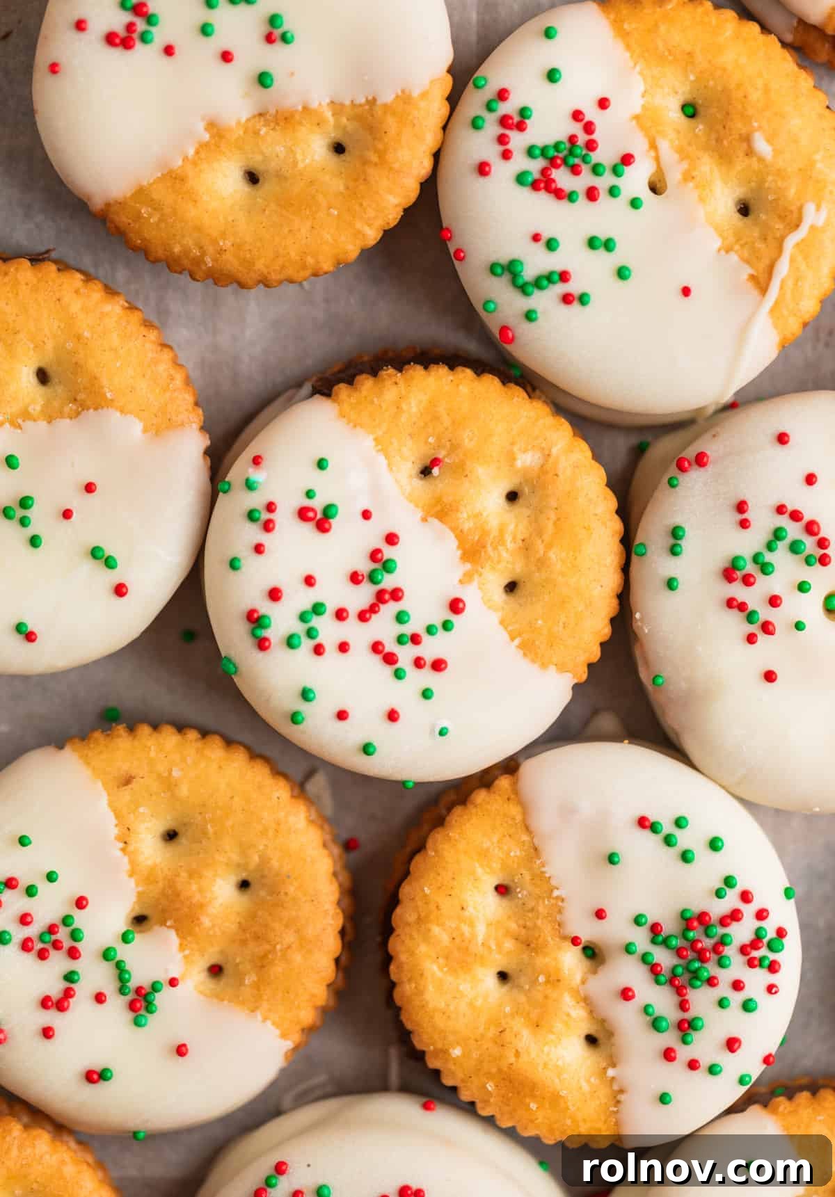 White chocolate dipped crackers with holiday sprinkles.