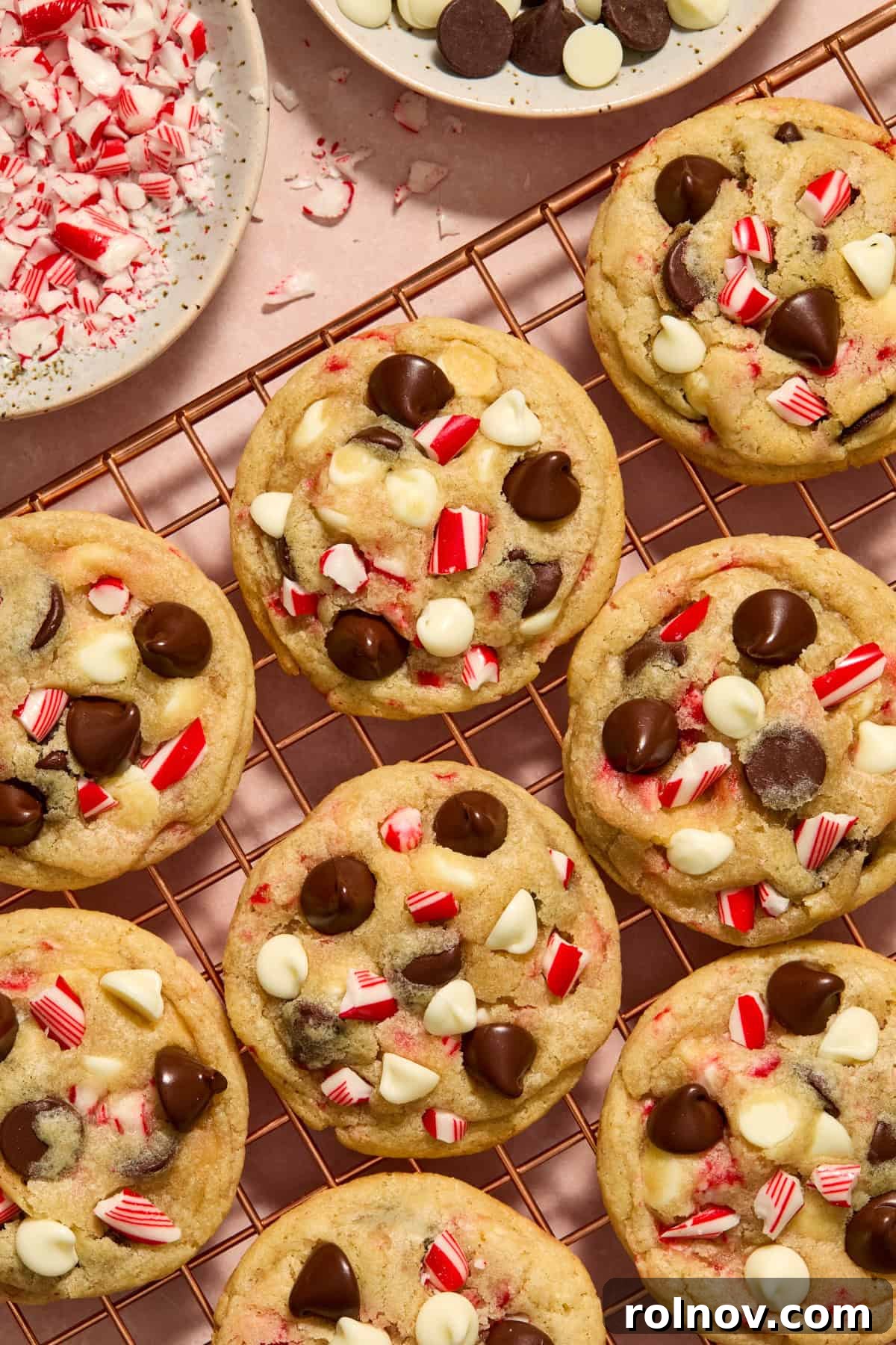 Cool Peppermint Chocolate Chip Cookies 16 A cooling rack laden with delicious candy cane chocolate chip cookies, with a bowl of chocolate chips and crushed candy canes nearby, showcasing a successful bake.