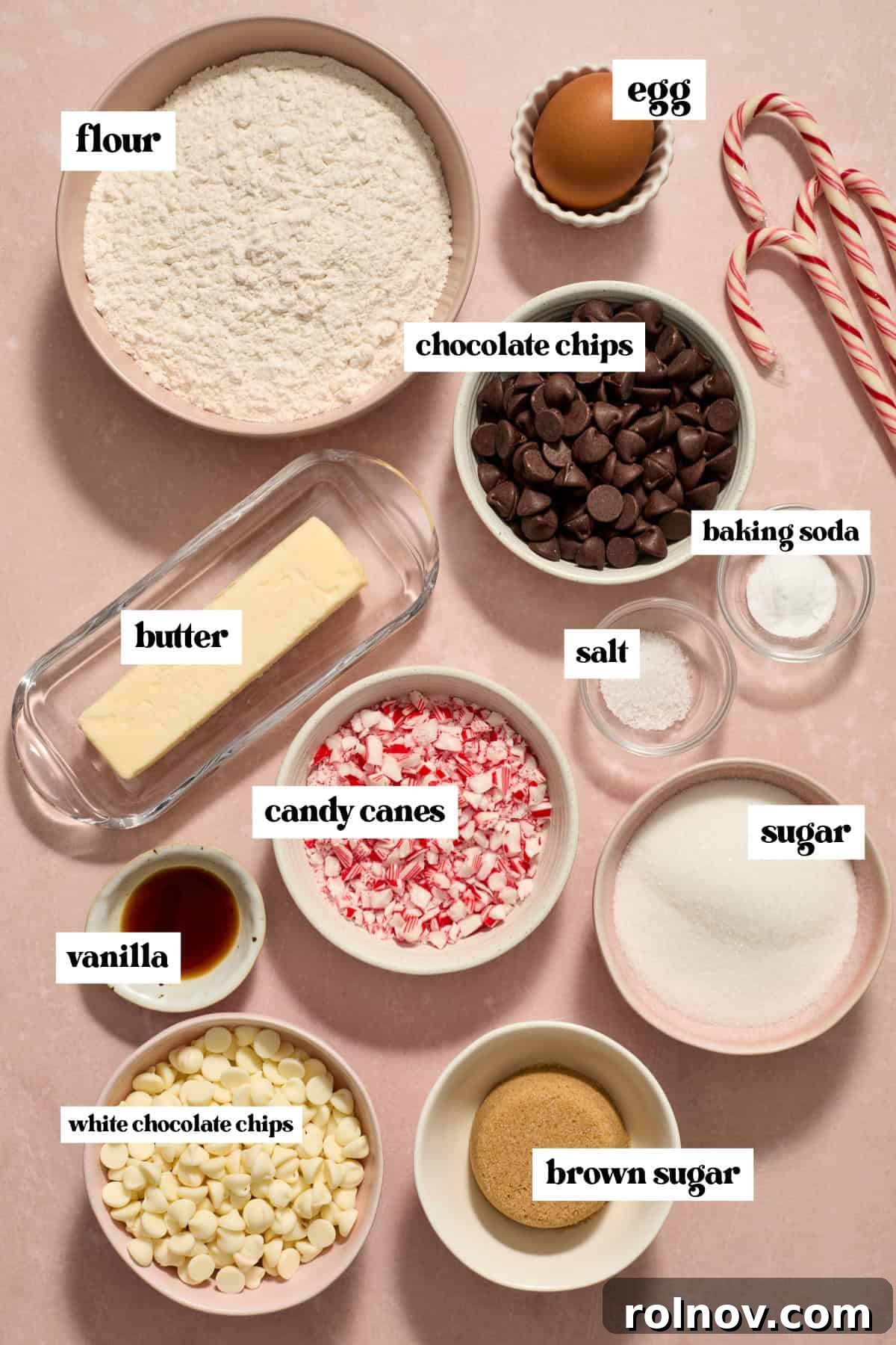 Cool Peppermint Chocolate Chip Cookies 4 Flour, candy canes, chocolate chips, and other essential ingredients meticulously arranged on a surface, awaiting assembly for the cookie recipe.
