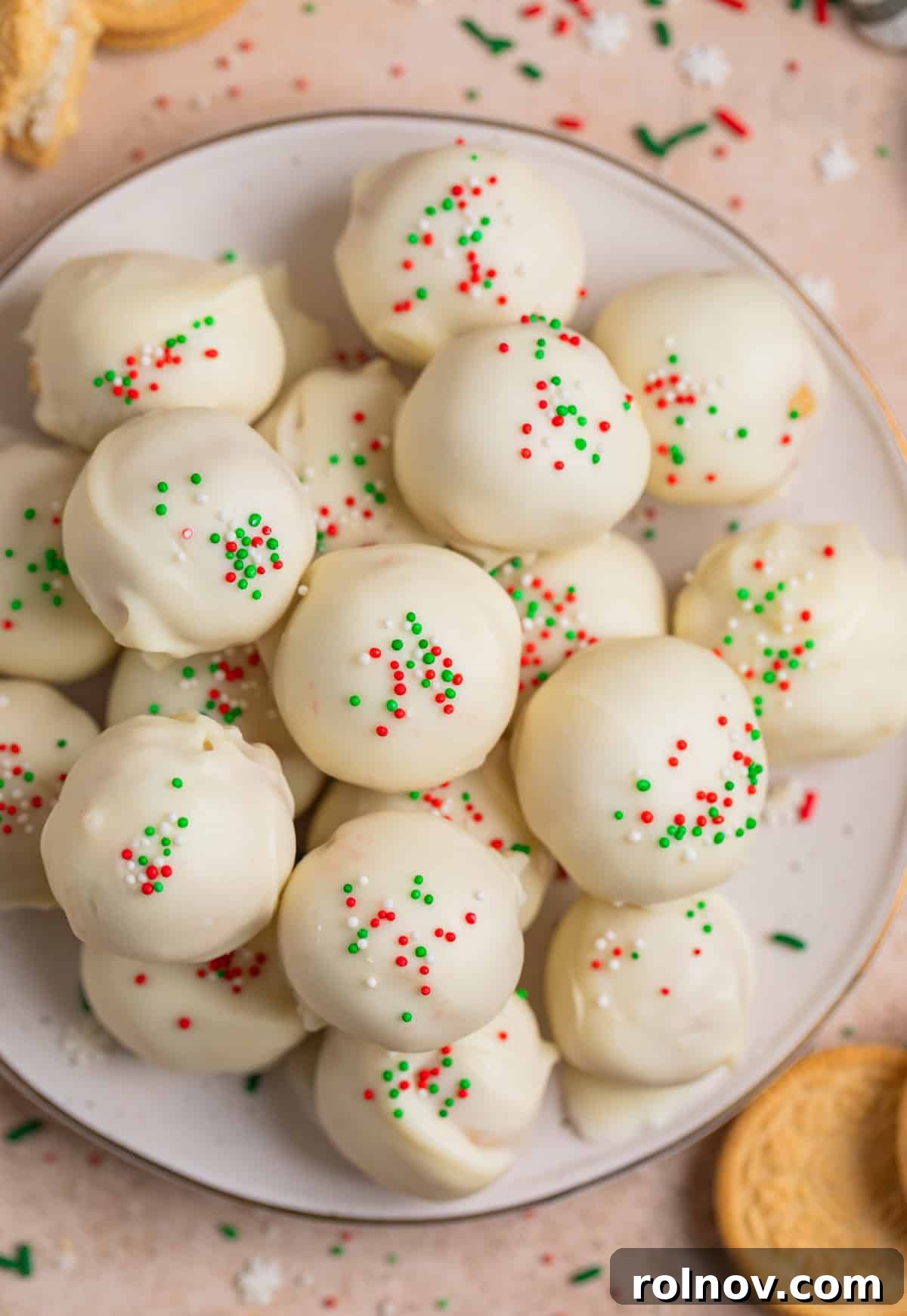 Plate with Oreo balls topped with red, white and green holiday sprinkles on plate.