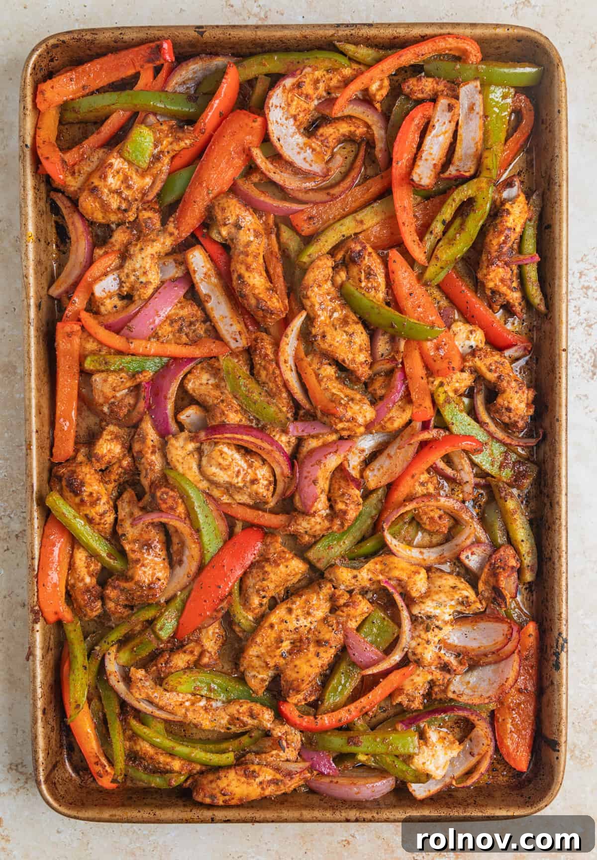 Baked chicken fajitas on sheet pan.