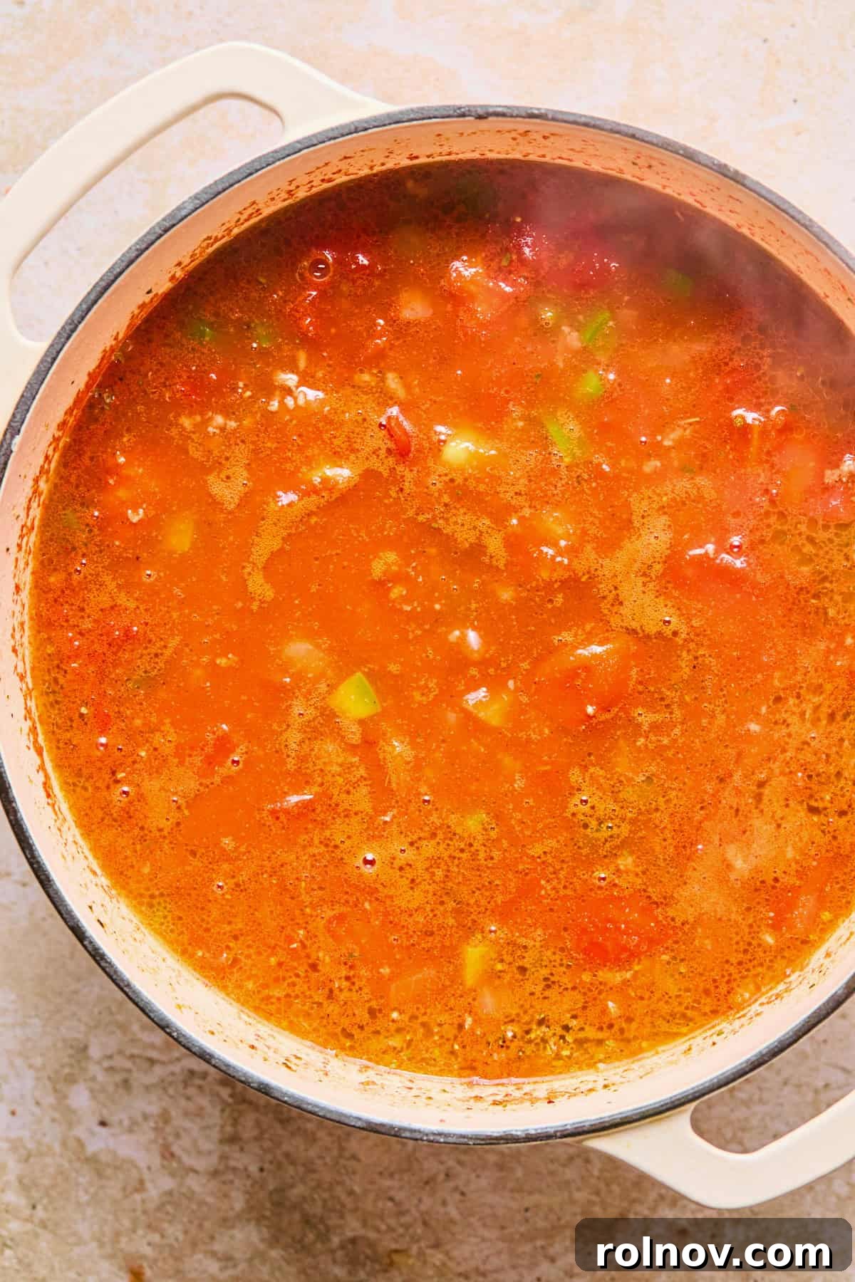 Hearty Skillet Chili Mac 9 The chili base, including broth and spices, simmering gently in the pot, ready for the pasta addition.
