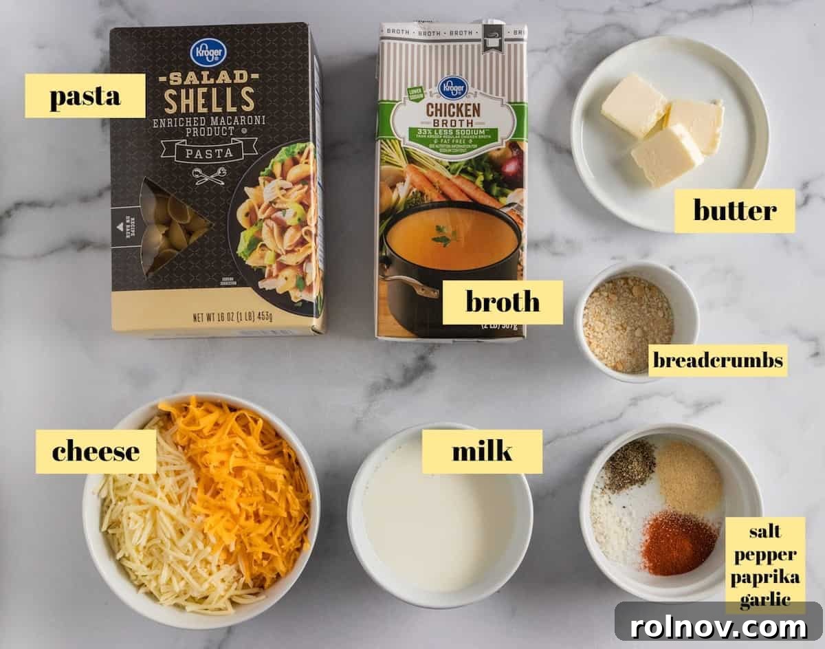 Foolproof Instant Pot Mac and Cheese 3 A flat lay photograph showcasing all the fresh ingredients needed to prepare Instant Pot Mac and Cheese, including pasta, cheese, butter, and seasonings.