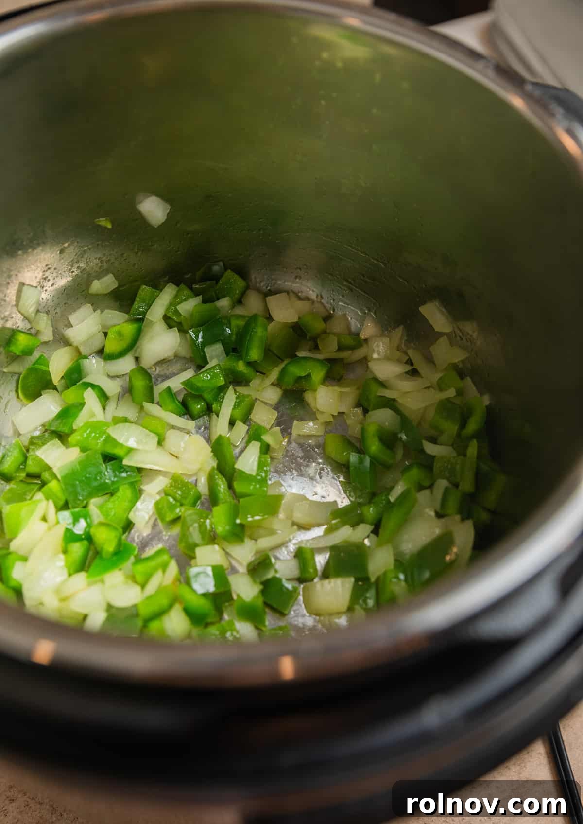 Ultimate Instant Pot Chicken Tortilla Soup 4 Green bell pepper and onions sautéed in Instant Pot.