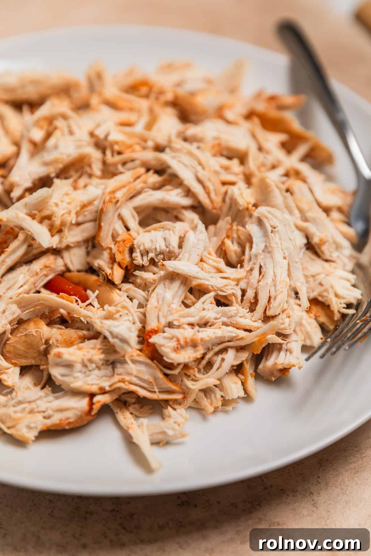 Ultimate Instant Pot Chicken Tortilla Soup 8 Shredded chicken on plate with forks.