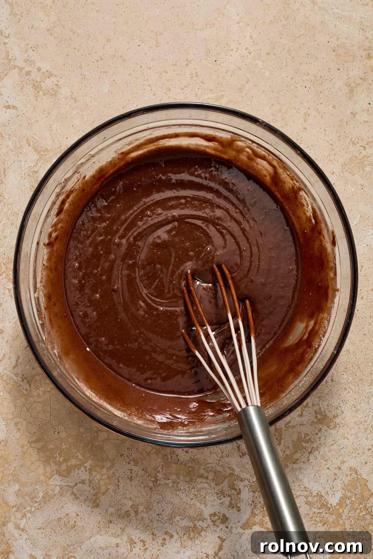 Kahlua Swirled Cream Cheese Brownie Bliss 4 Brownie mix being whisked in a glass bowl.