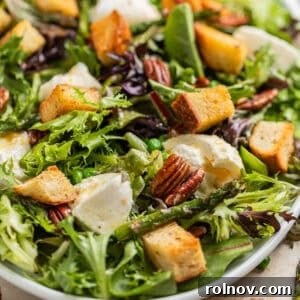 Green salad with burrata, sourdough croutons, pecans, peas and topped with citrus dressing.