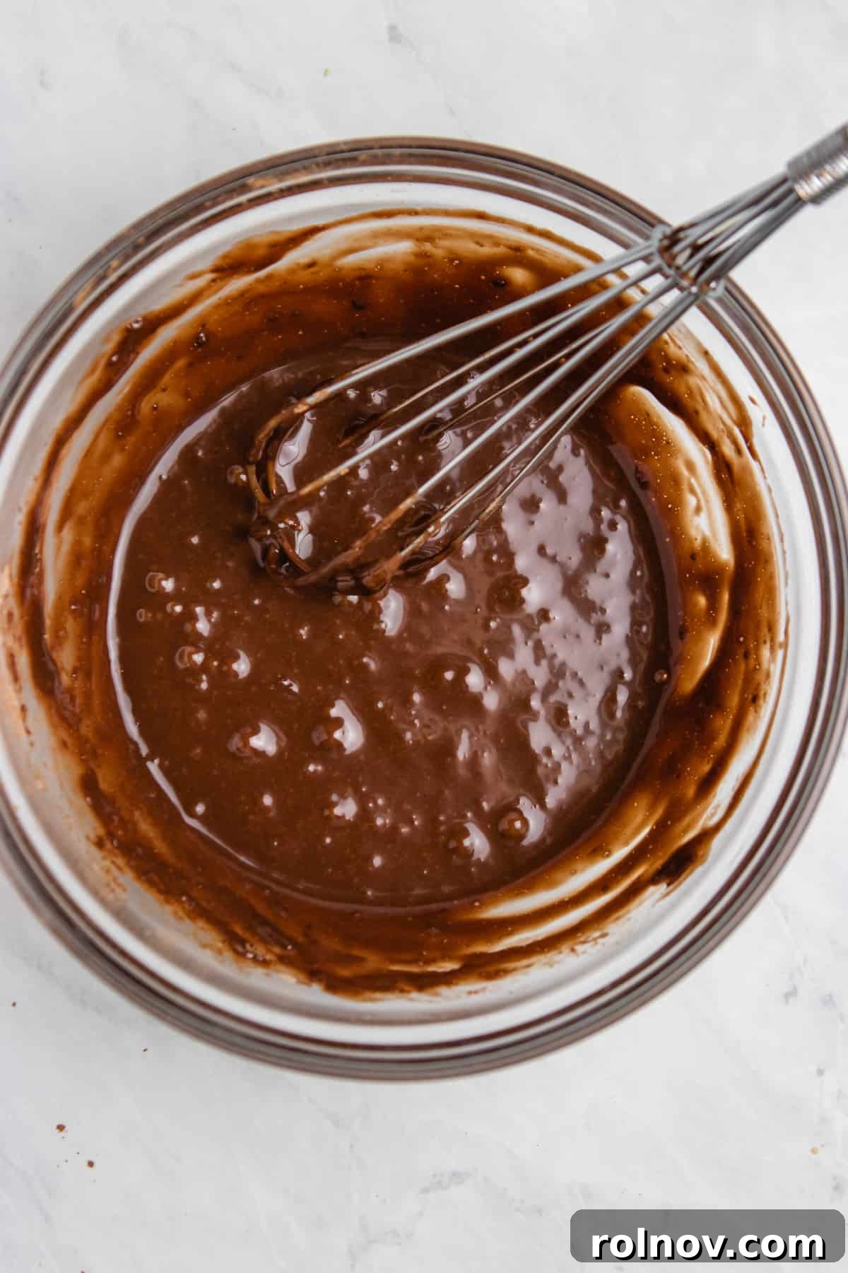 5-Minute Nutella Mug Cake 4 Whisked Nutella mug cake batter in a mixing bowl, ready for microwaving.