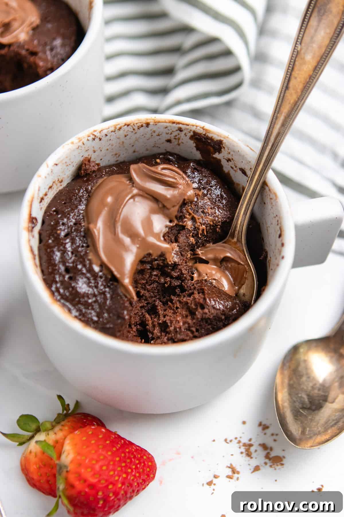 5-Minute Nutella Mug Cake 6 Mug cake with Nutella and strawberries as a topping.