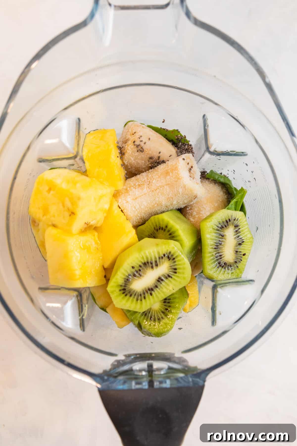 Zesty Green Kiwi Pineapple Boost 3 Pineapple, banana, kiwi and other ingredients in blender.