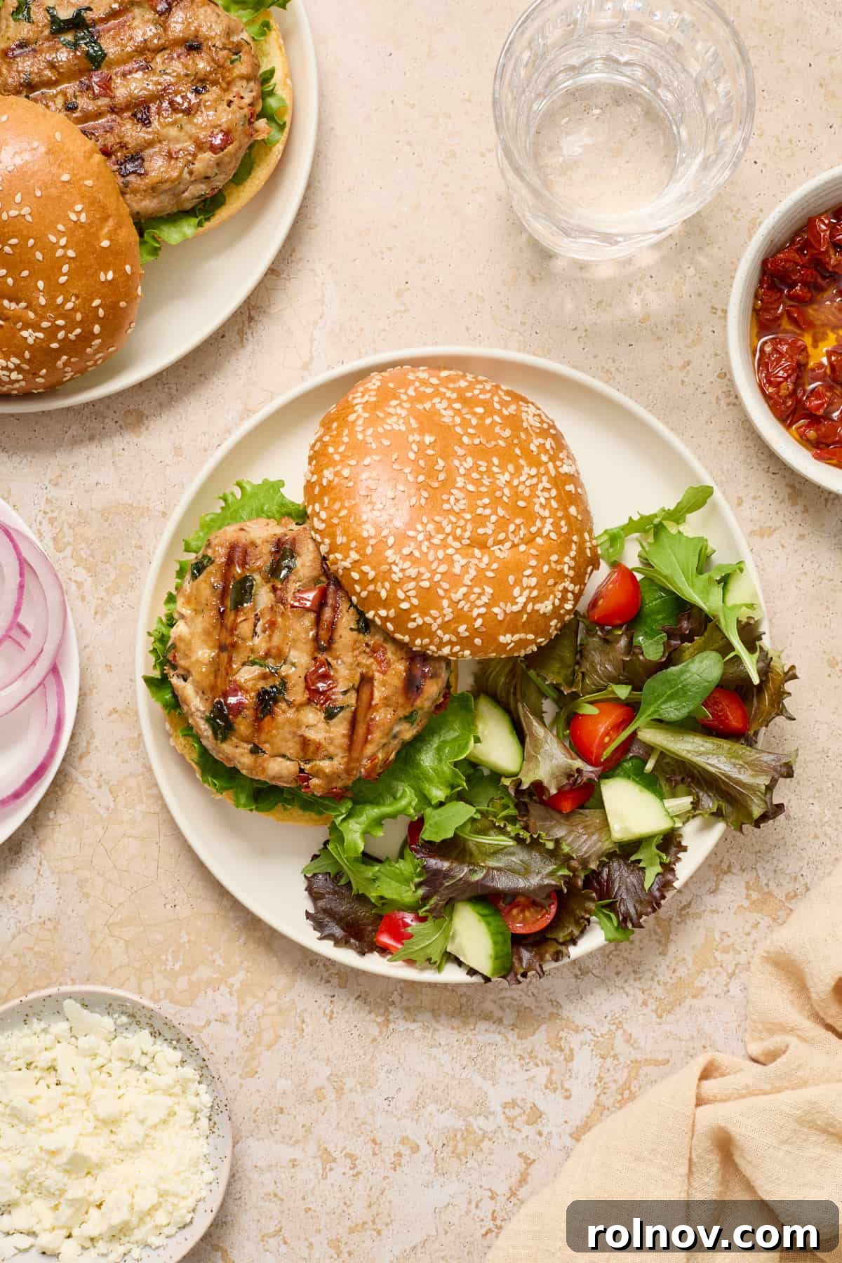 Turkey burger on plate with bun slightly aside to show the burger patty.