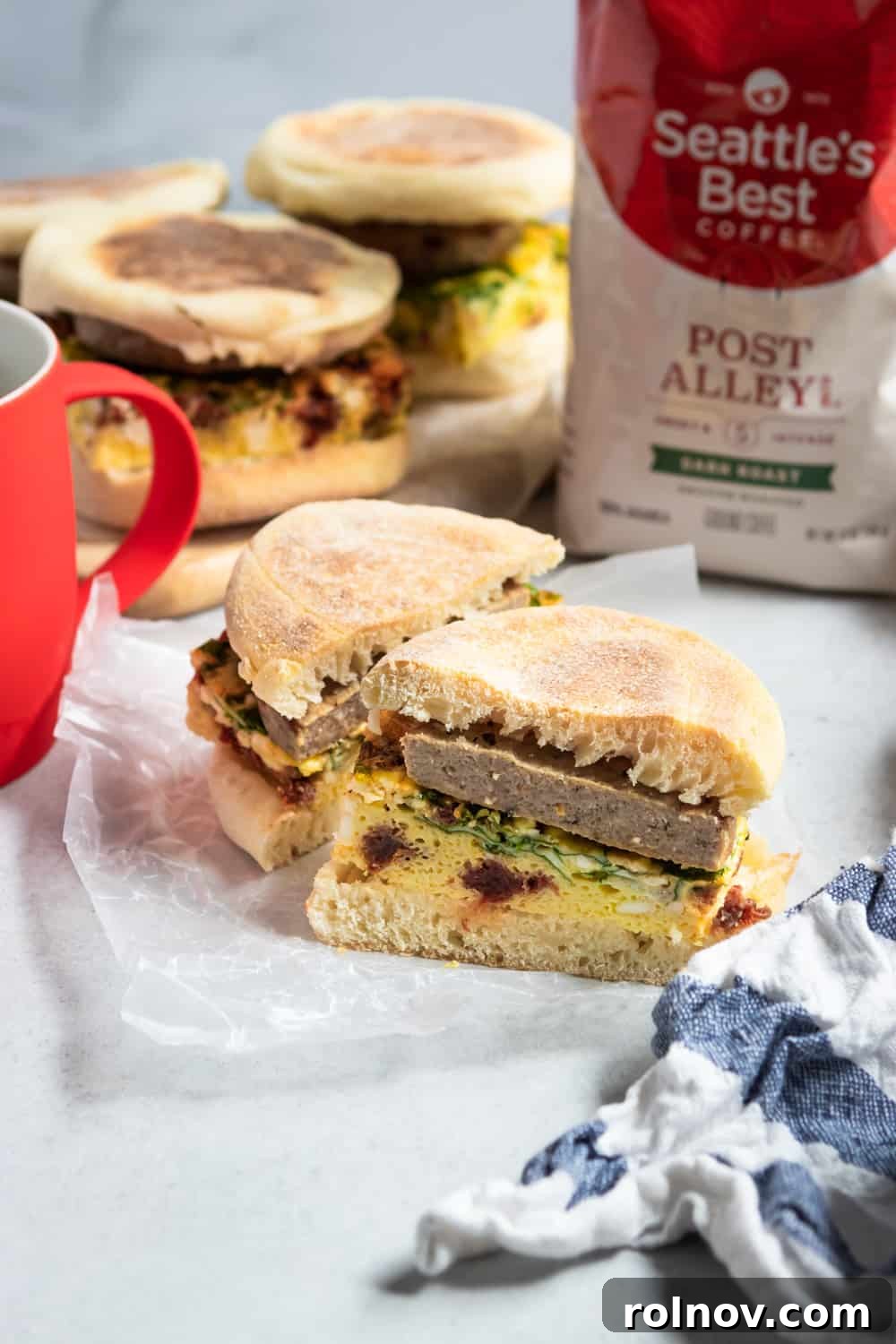 Ready-to-Go Spinach Feta Breakfast Sandwiches 2 Stacked freezer breakfast sandwiches with spinach, feta, and sun-dried tomatoes, ready for a busy morning.