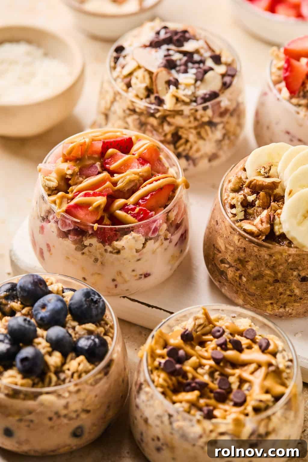 6 Simple Overnight Oats to Master Your Mornings 2 Glasses with overnight oats recipes prepared and topped with different garnishes.