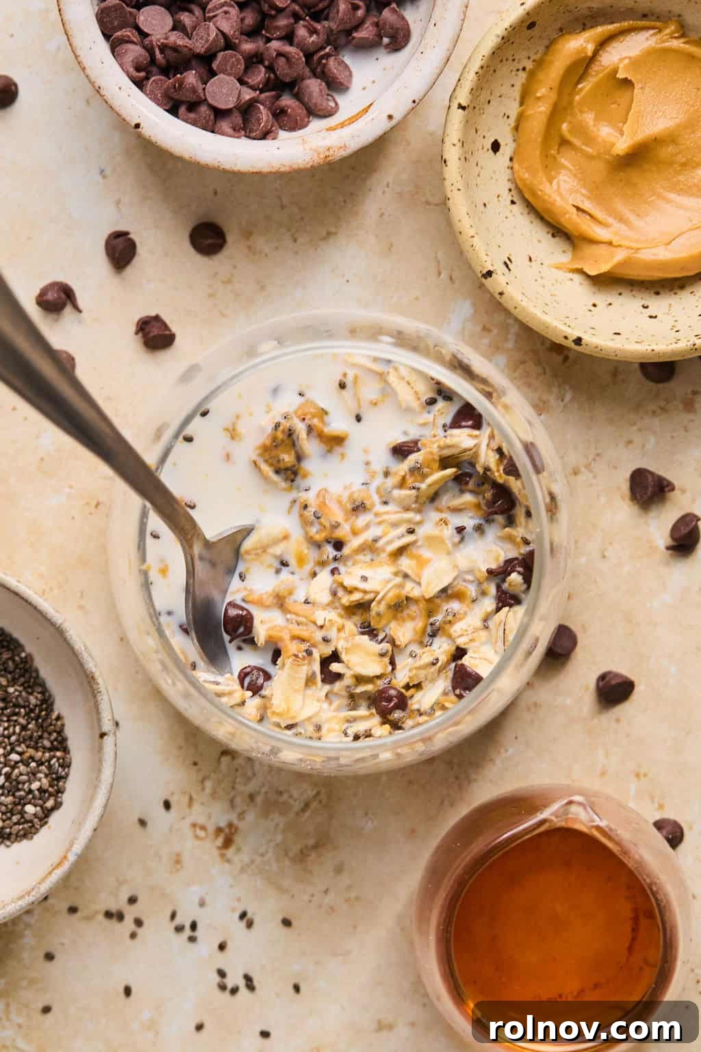 6 Simple Overnight Oats to Master Your Mornings 6 Stirred prepped oats in jar with spoon.