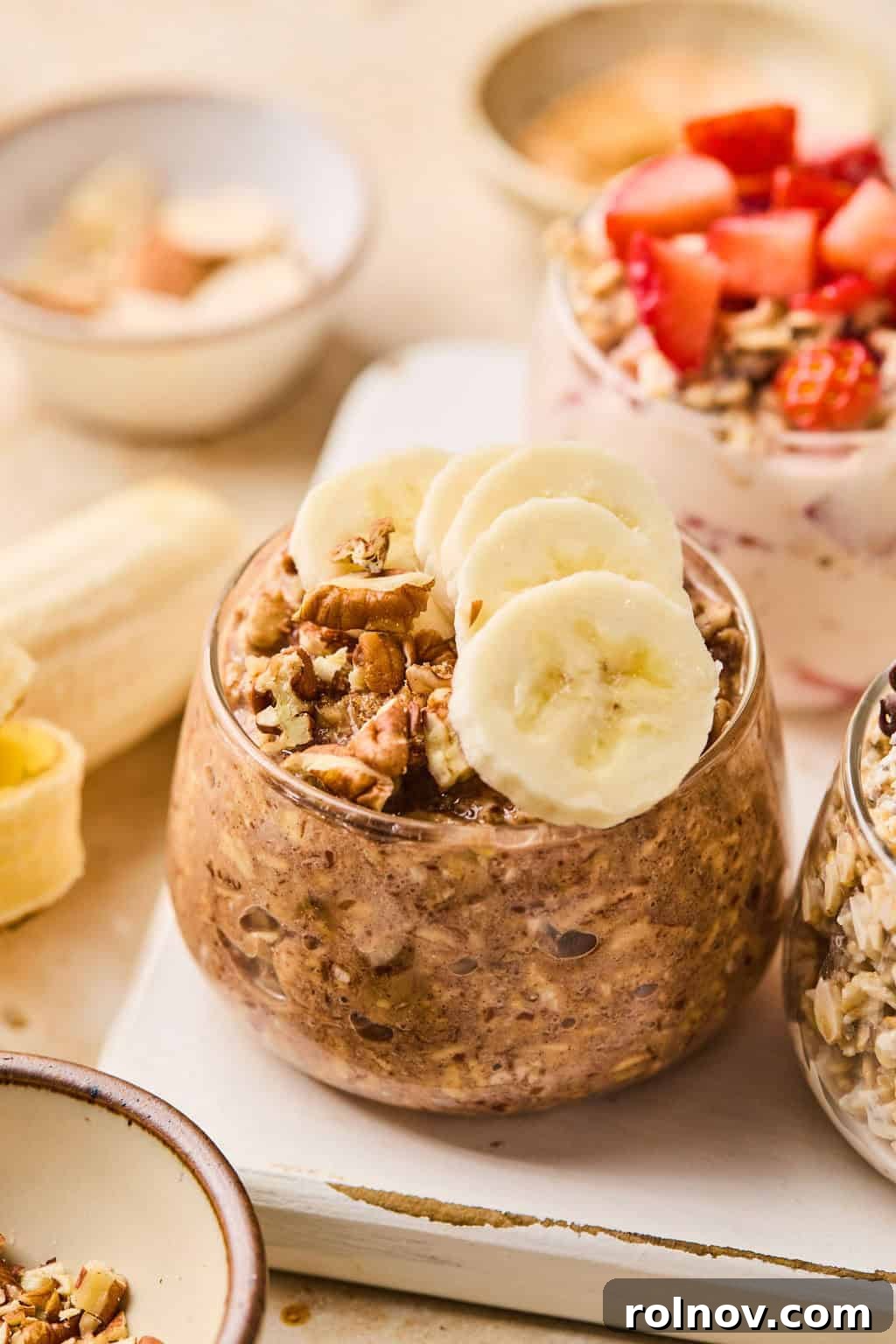 6 Simple Overnight Oats to Master Your Mornings 7 Banana bread overnight oatmeal in glass topped with sliced bananas.