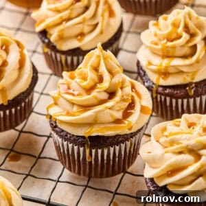 Salted Caramel Mocha Dream Cupcakes 5 Chocolate espresso cupcakes topped with caramel buttercream on cooling rack.