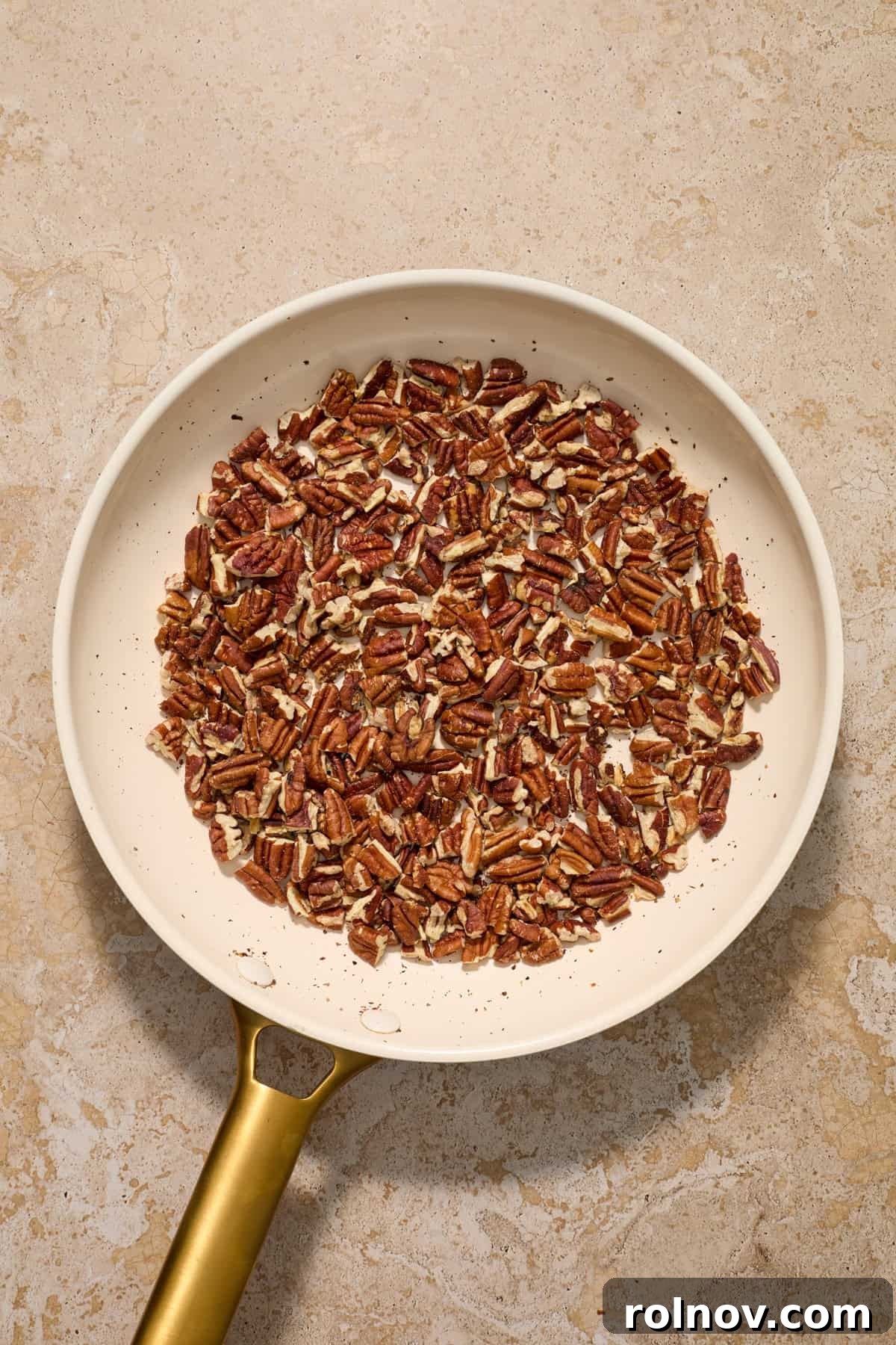 Velvety Pecan Cream Cheese Snowflakes 5 Toasted pecan pieces in skillet.