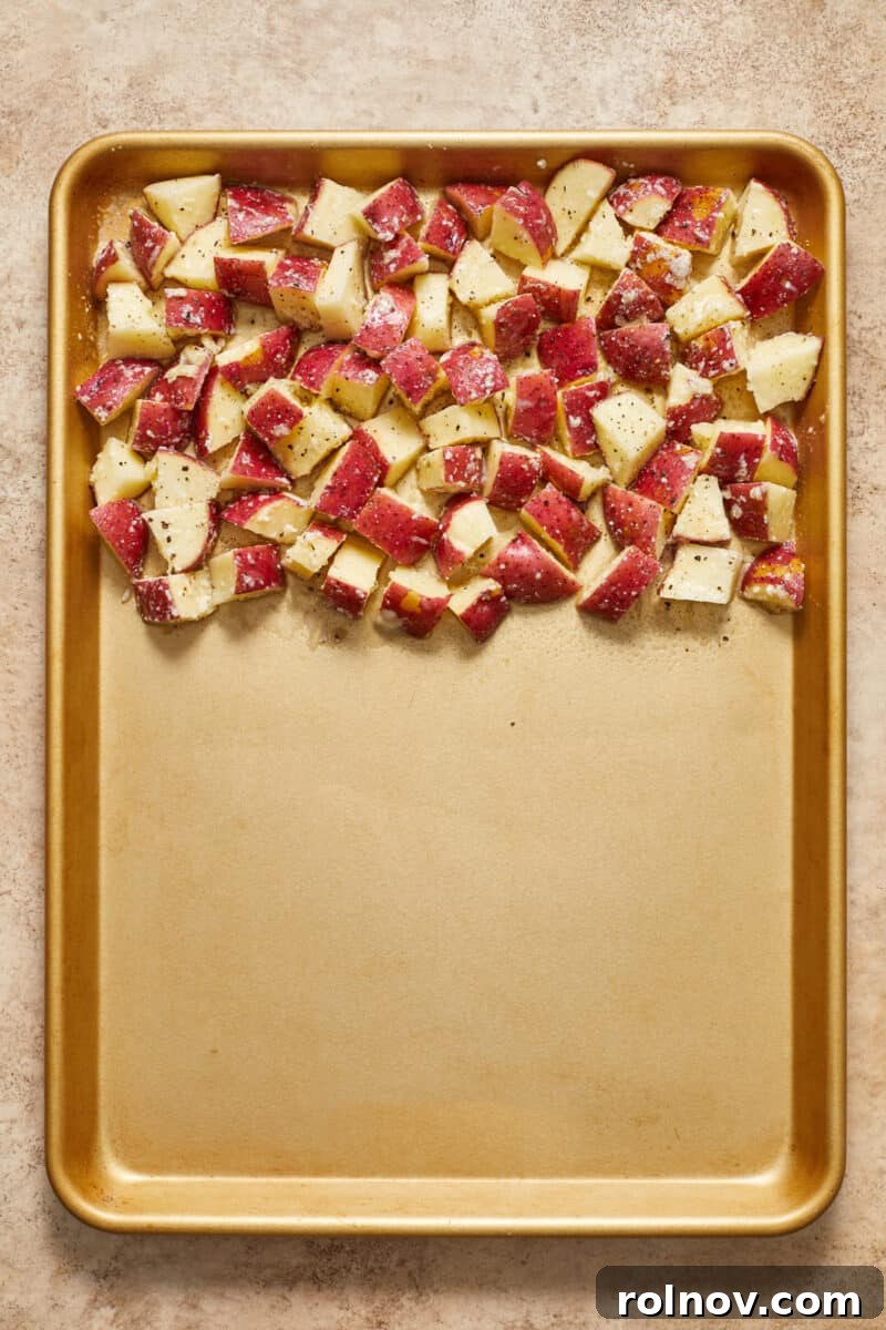Golden Parmesan Chicken Sheet Pan Feast 6 Potatoes on sheet pan.
