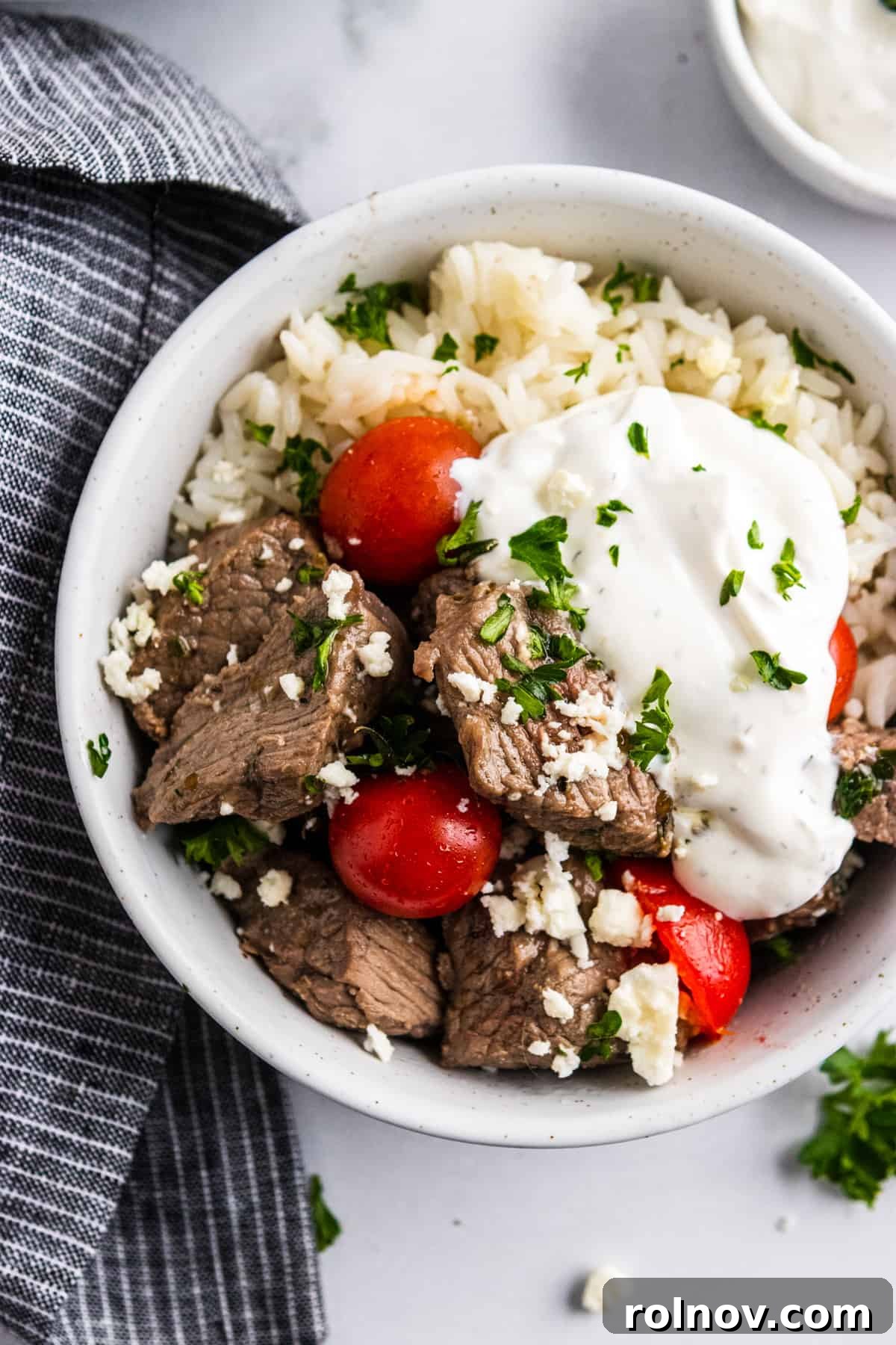 Rice bowl with Mediterranean steak bites and yogurt sauce.