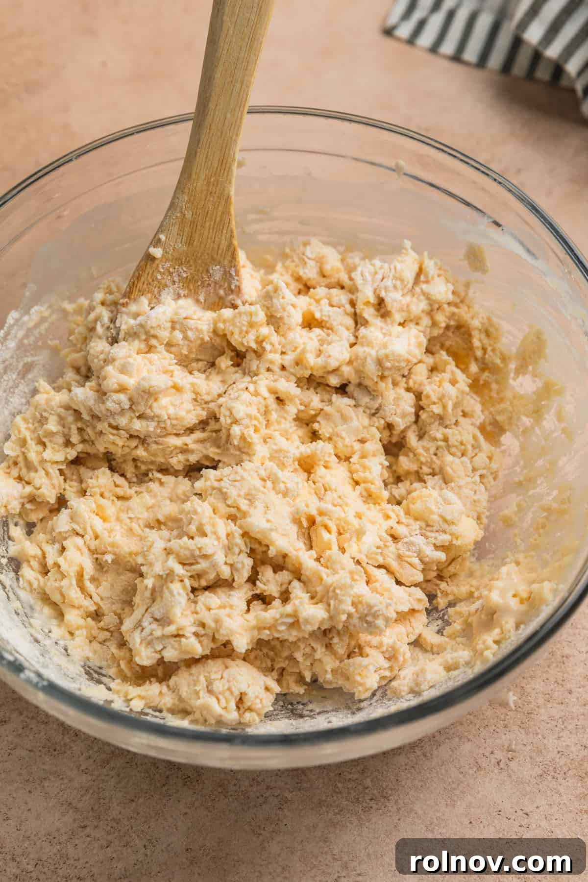 Golden Honey Biscuits 7 Honey biscuit dough mixture in glass mixing bowl.
