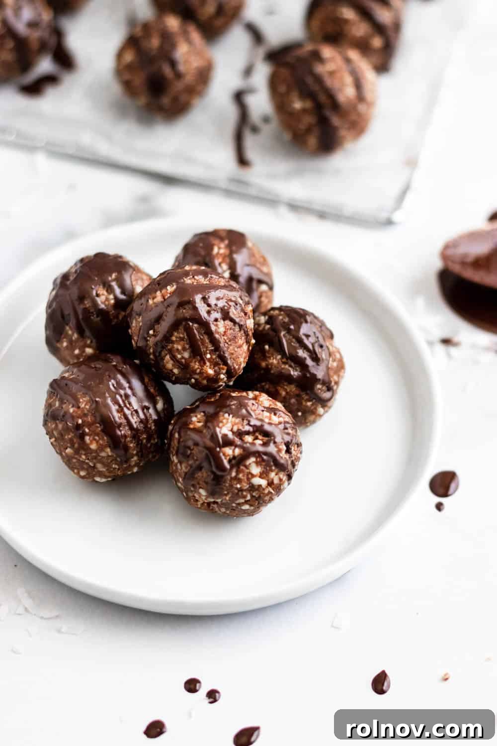 Chewy Chocolate Coconut Energy Bites 2 Irresistible no-bake chocolate coconut date balls with a luscious chocolate drizzle, perfect for a quick and healthy snack.