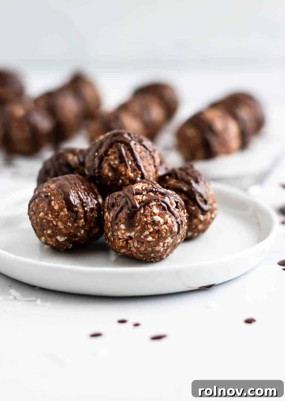 Chewy Chocolate Coconut Energy Bites 4 A tray of freshly made chocolate coconut date balls, ready for chilling and serving.