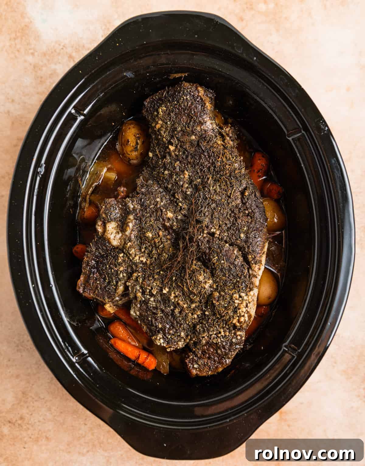 Slow Cooker Beef Pot Roast 8 Cooked chuck roast in crock pot.