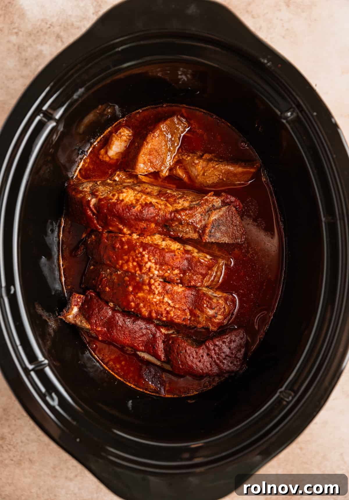 Slow Cooker BBQ Country Style Ribs 7 Cooked country style ribs in the crock pot, immersed in rich BBQ sauce, ready to serve.