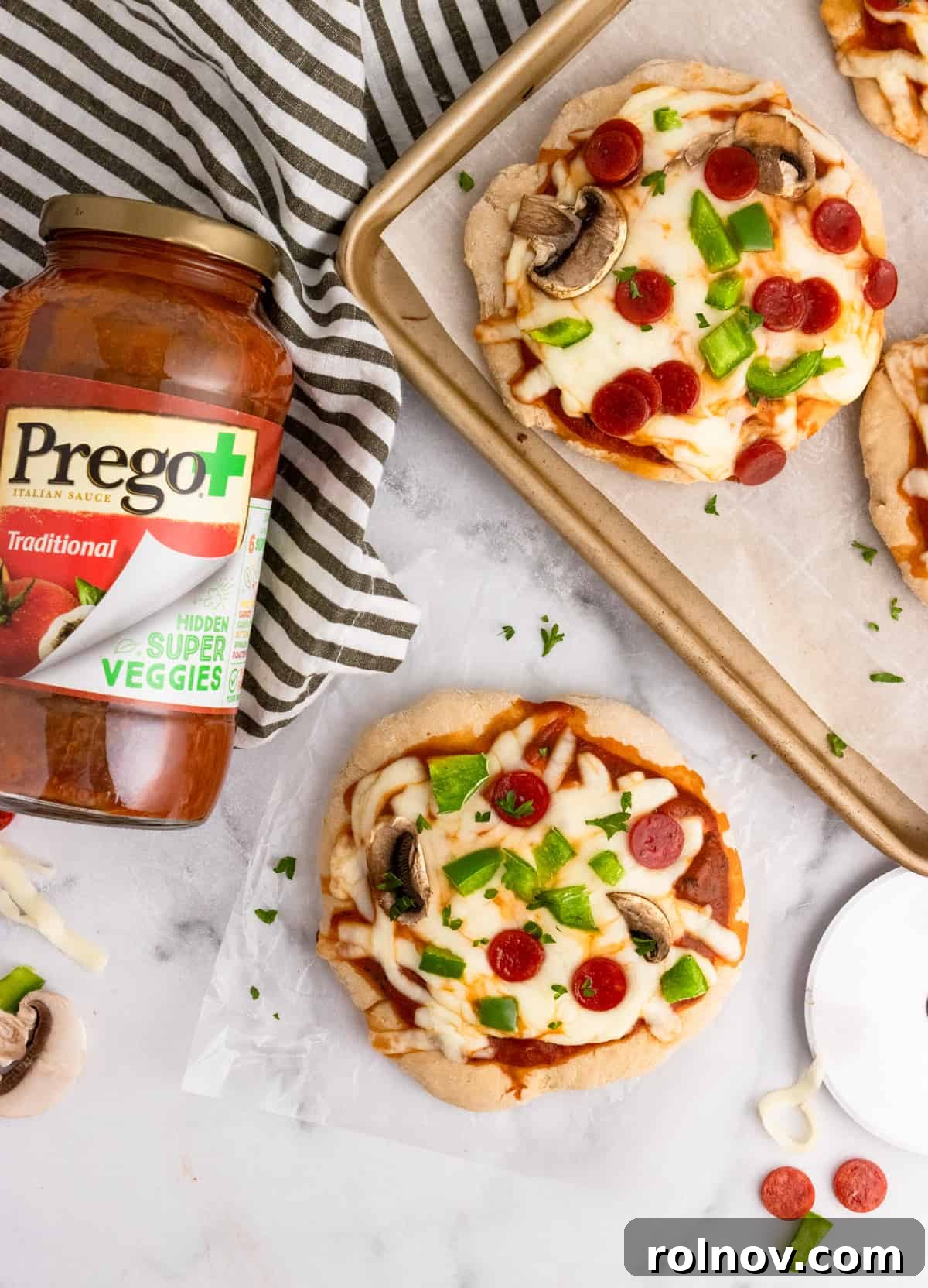 Stealthy Veggie Whole Wheat Pizza Bites 2 Overhead shot of pizzas on pan with tomato sauce jar.