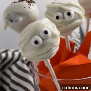 A beautifully decorated Halloween cake pop, showcasing its vibrant colors and festive appeal.