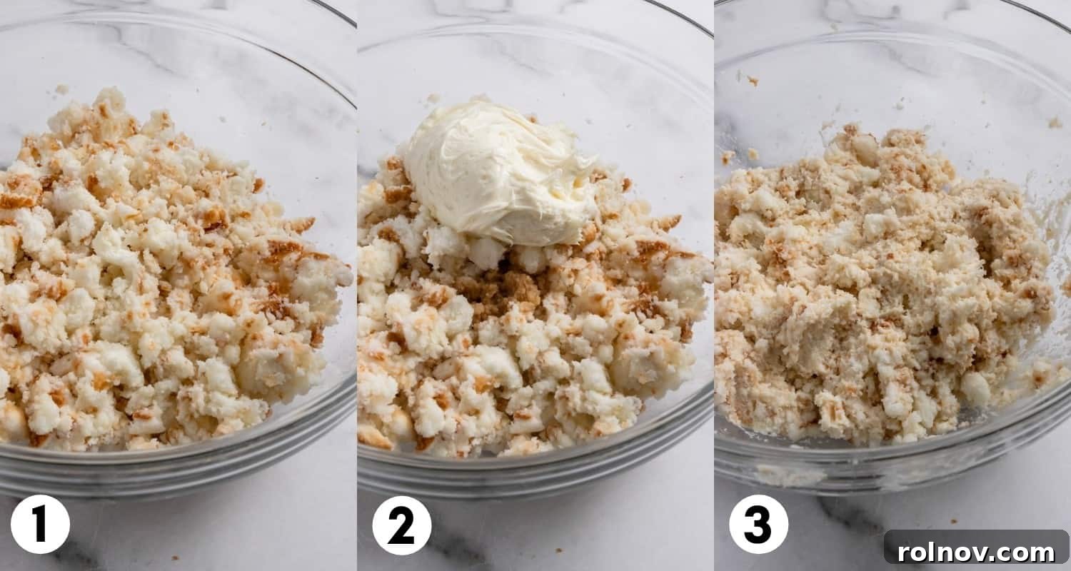 Close-up shot of crumbled Angel Food cake mixed with creamy vanilla frosting in a bowl, forming a soft, cohesive cake pop dough.