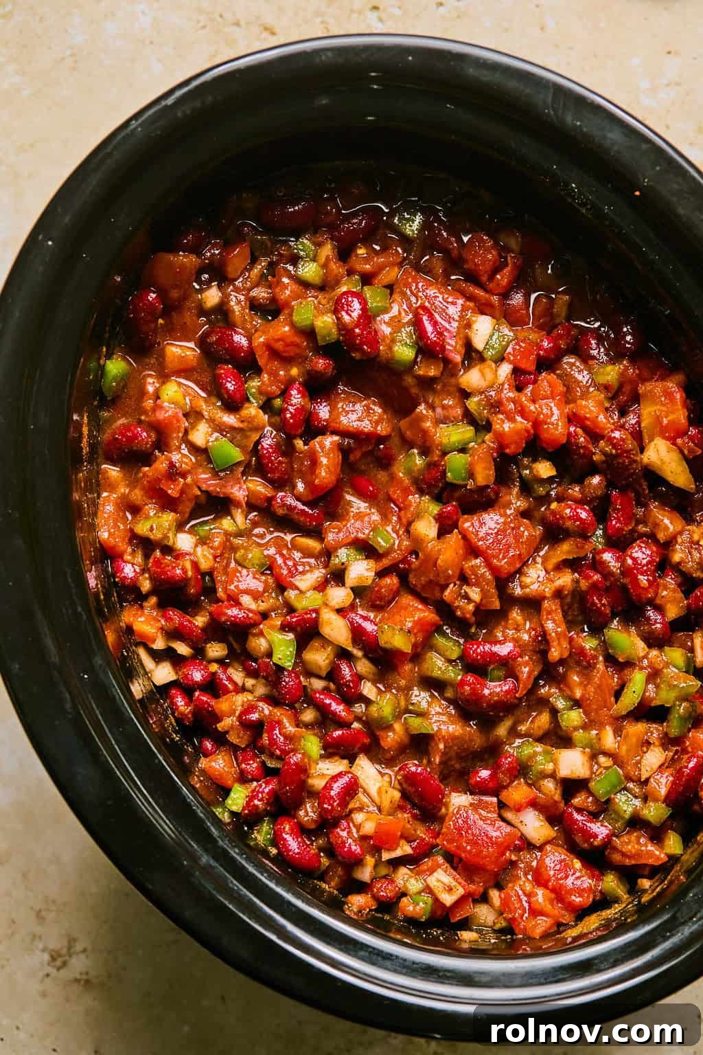 All ingredients assembled in the slow cooker, ready for cooking.
