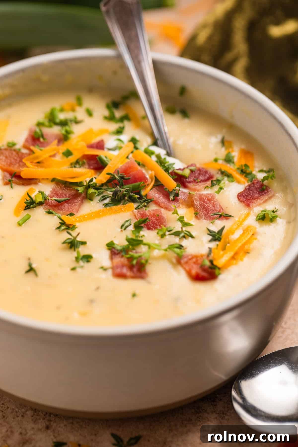 Creamy Instant Pot Potato Leek Soup 2 Bowl of Instant Pot Potato Leek soup topped with cheese, bacon, chives and fresh thyme.