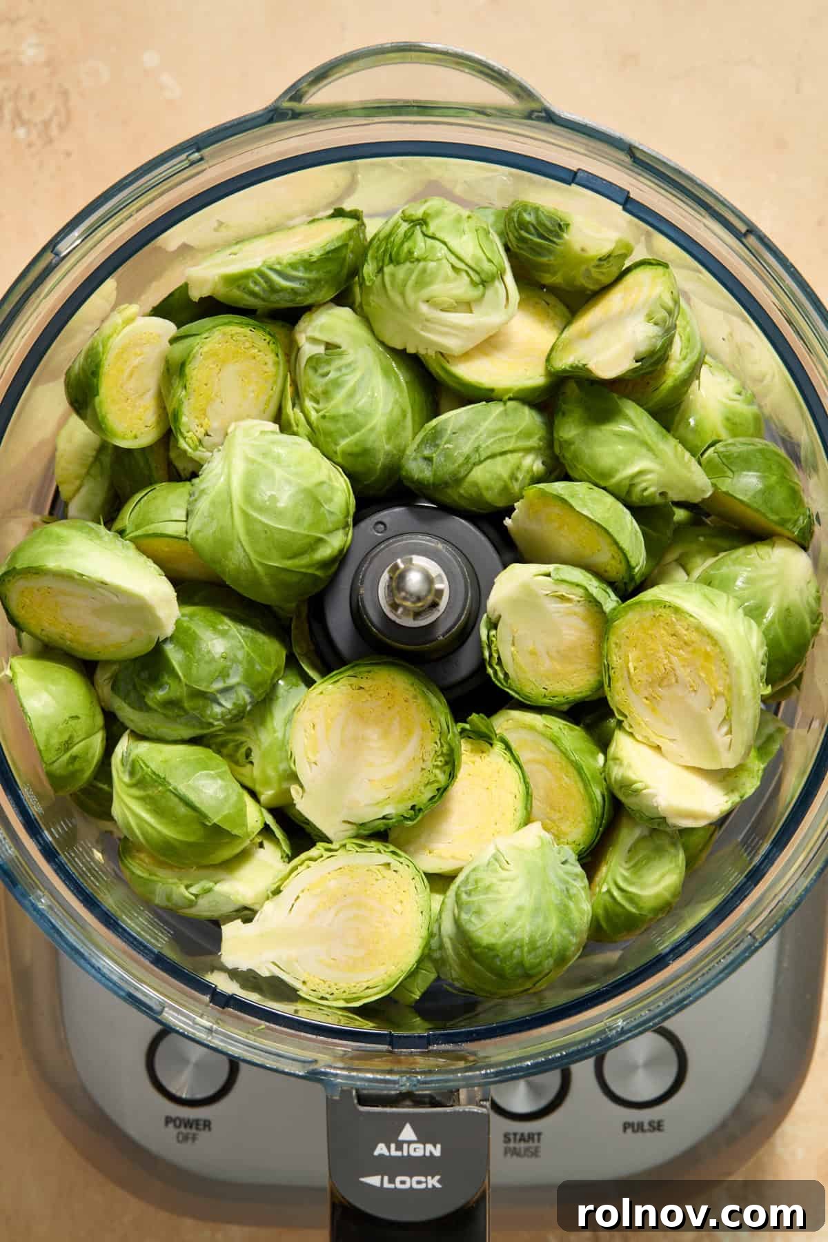 Zesty Brussels Sprout Slaw 4 Brussels sprouts halved and added to food processor before being shredded.