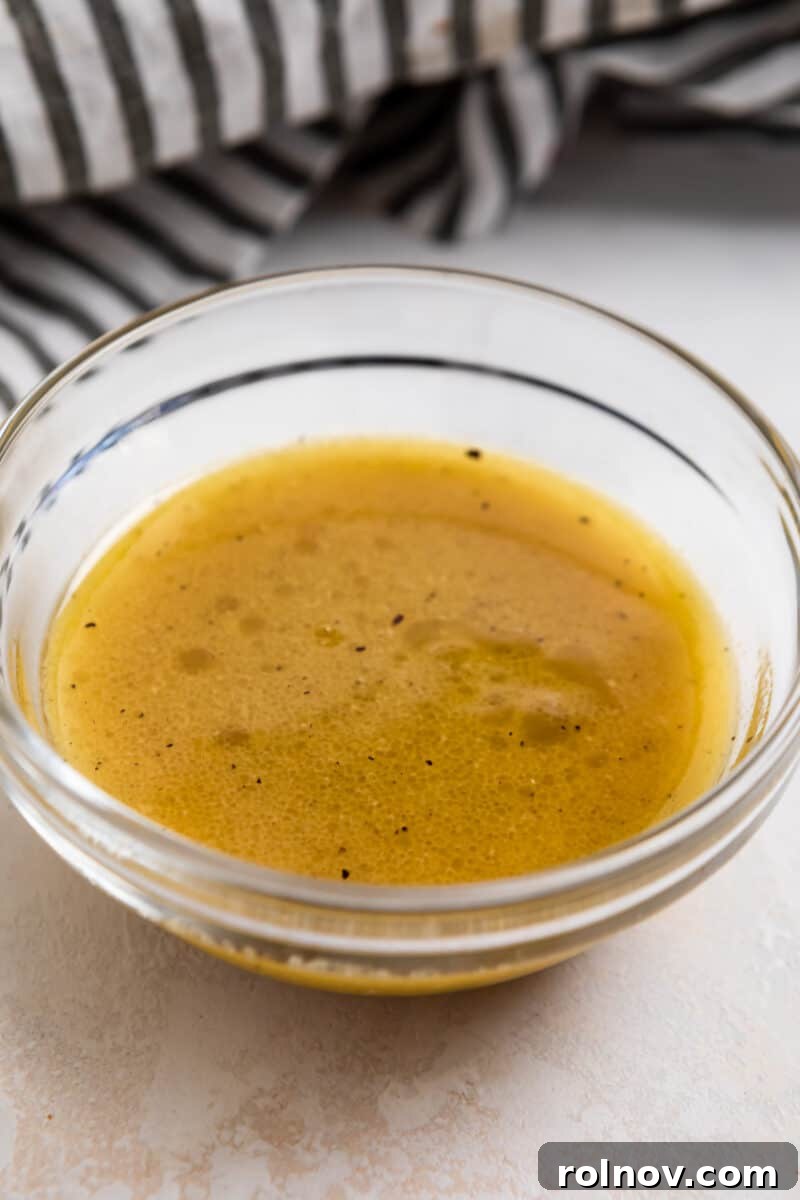 Golden Roasted Pear Salad 5 White balsamic vinaigrette dressing in glass bowl.
