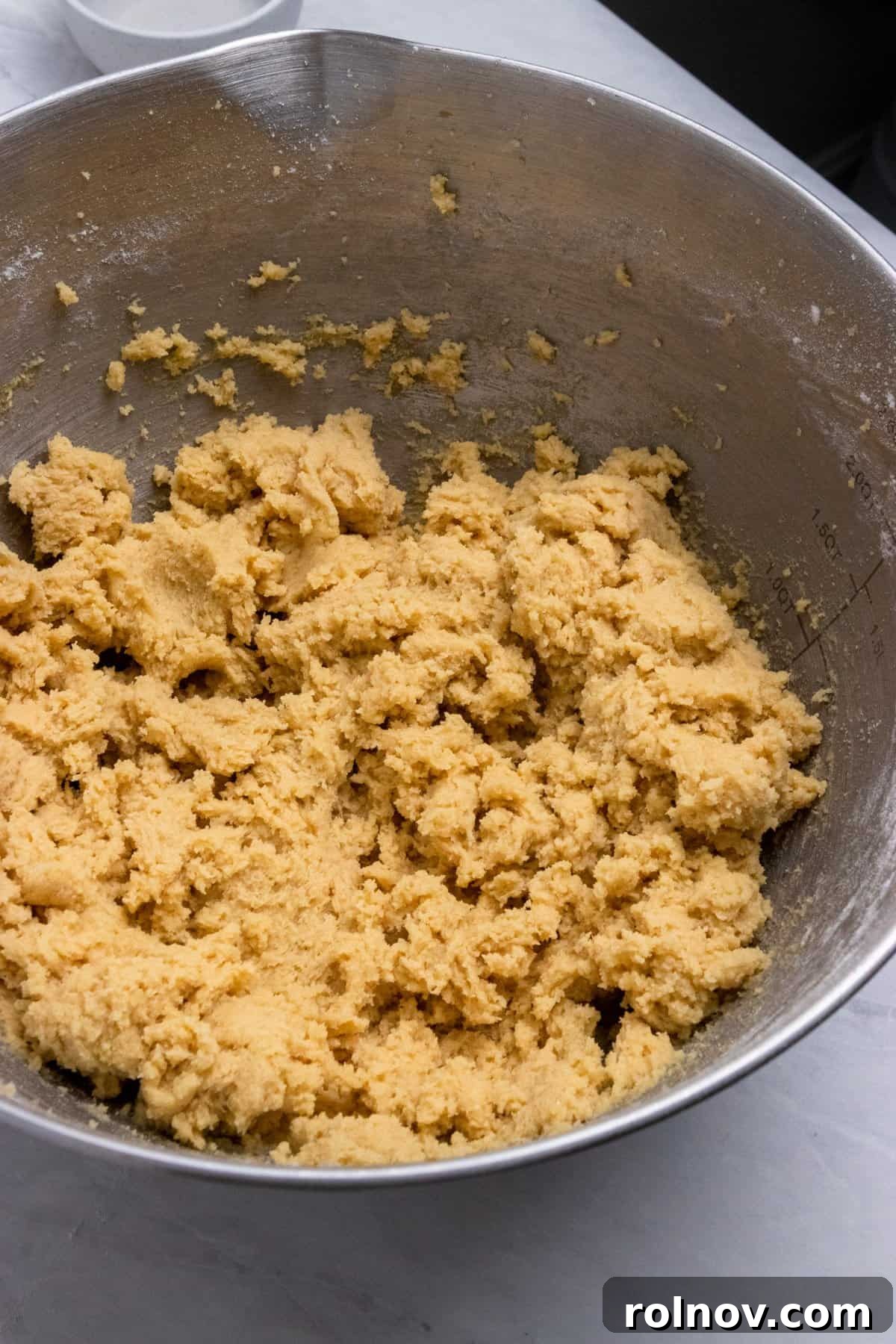 Charmed Bites 5 Butter and sugars expertly creamed together in a mixing bowl, creating a light and fluffy base for the cookie dough.