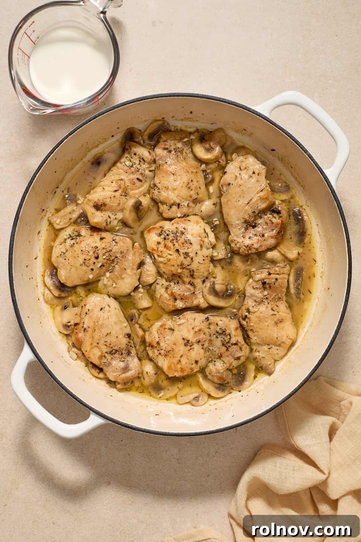 Golden Chicken Thighs in Velvety Mushroom Sauce 7 White wine added to skillet with chicken and mushrooms.