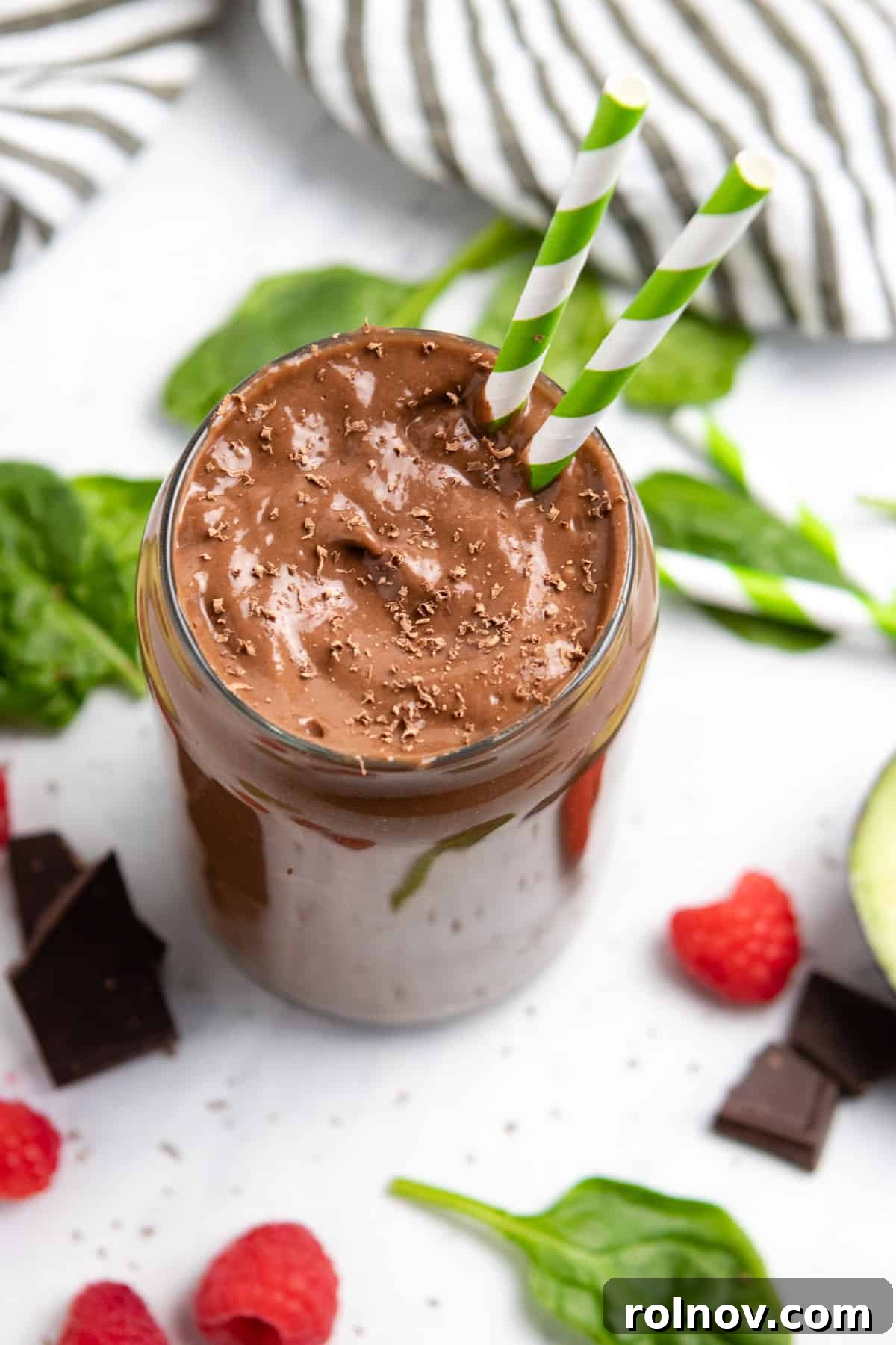 Silky Chocolate Raspberry Avocado Delight 2 Chocolate raspberry smoothie in glass with chocolate shavings.