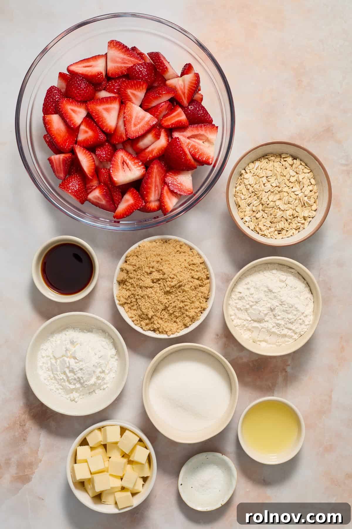 Crimson Crumble Dream 4 Oats, butter, brown sugar, vanilla and other ingredients in dishes on surface.