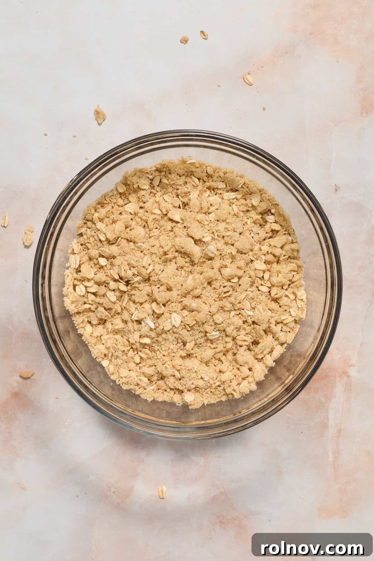 Crimson Crumble Dream 7 Oat crumble mixture tossed together in bowl.